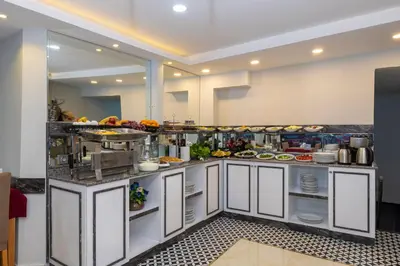 a large kitchen with a buffet of food at Hotel Yesilpark in Istanbul
