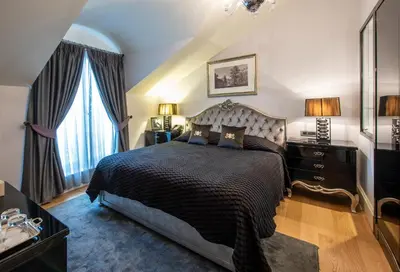 a bedroom with a large bed and a window at Pera Palace Hotel in Istanbul