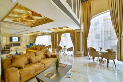 a living room with a couch and a table at Büke Hotel Şişli in Istanbul