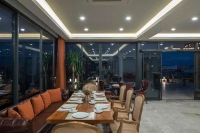 a dining room with a table and chairs at AKKA Lush Hotel Taksim in Istanbul