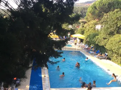 a group of people swimming in a swimming pool at Atamer Doga Resort in Gemlik