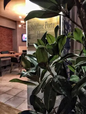 a plant in front of a sign in a lobby at Sublime Porte Hotel in Istanbul