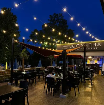 a restaurant with tables and chairs at night at Sapanca Aqua Wellness Spa Hotel in Sapanca