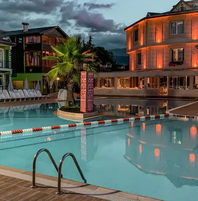 a large swimming pool in front of a building at Sapanca Aqua Wellness Spa Hotel in Sapanca