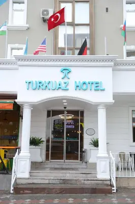 a turkish hotel with a sign on a building at Turkuaz Hotel in Gebze