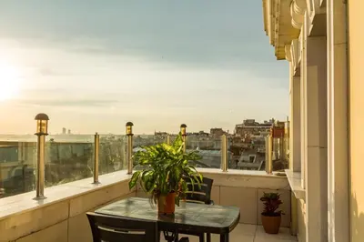 a table on a balcony with a view of a city at Grand Rosa Hotel in Istanbul