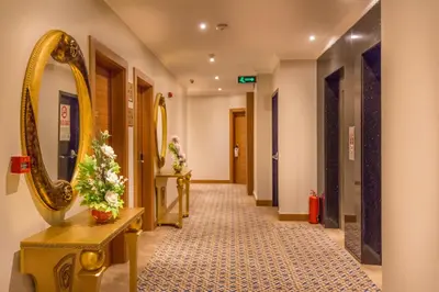 a hallway with a mirror in a hotel room at Grand Rosa Hotel in Istanbul