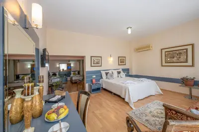a large room with a bed and a living room at Grand Ons Hotel in Istanbul