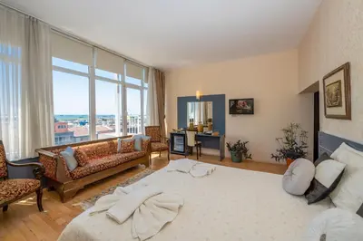 a living room with a bed and a couch at Grand Ons Hotel in Istanbul