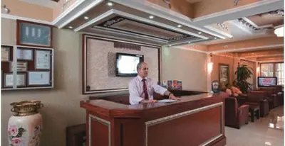 a man standing at a bar in a restaurant at Hotel Bazaar in Istanbul
