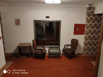 a room with chairs and a table and a mirror at Hotel Bazaar in Istanbul
