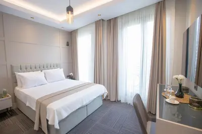 a hotel room with a bed and a glass table at Anatolia Inn in Istanbul