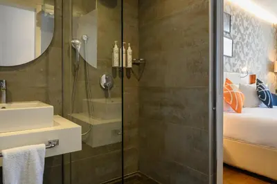 a bathroom with a shower and a sink at Four Points Flex by Sheraton Istanbul Taksim Square in Istanbul
