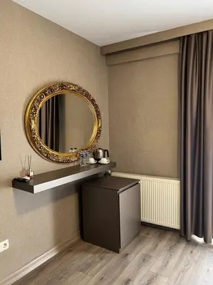 a dressing room with a mirror and a table at Flower Palace Hotel in Istanbul