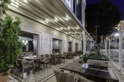 a patio with tables and chairs on a building at Levni Hotel & SPA - Special Category in Istanbul