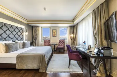 a hotel room with a bed and a desk at Levni Hotel & SPA - Special Category in Istanbul