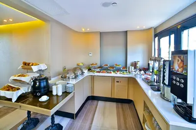a kitchen with a counter with food on it at Beethoven Hotel & Suite in Istanbul