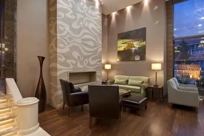 a living room with a couch and a fireplace at Marigold Thermal & Spa Hotel Bursa in Bursa