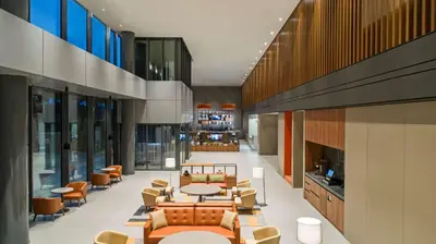a lobby with couches and tables and chairs at Hyatt House Gebze in Gebze