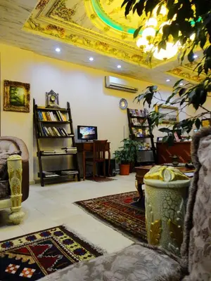 a living room with a gold ceiling and a couch at Basileus Hotel in Istanbul