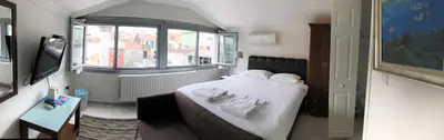 a small room with a bed and a window at My Kent Hotel in Istanbul