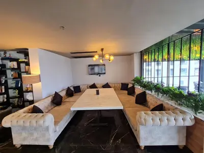 a large living room with a long table and chairs at Air Boss Istanbul Airport and Fair Hotel in Istanbul