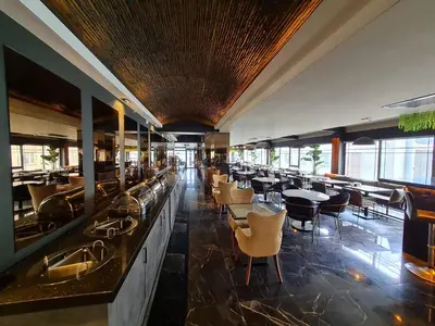 a dining room with tables and chairs in a restaurant at Air Boss Istanbul Airport and Fair Hotel in Istanbul