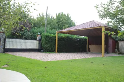a pavilion in a yard with a fence at Damla Pansiyon in Sapanca