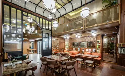 a restaurant with tables and chairs and windows at Hotel Momento Golden Horn in Istanbul