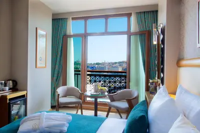 a hotel room with a bed and a balcony at Hotel Momento Golden Horn in Istanbul