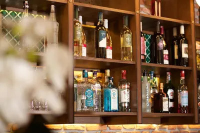 a shelf filled with lots of bottles of alcohol at Hotel Momento Golden Horn in Istanbul
