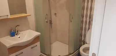 a bathroom with a shower and a sink and a toilet at Sawsana Villalari in Sapanca
