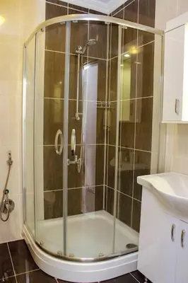 a shower with a glass door in a bathroom at Sawsana Villalari in Sapanca