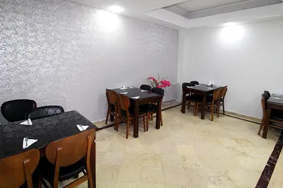 a dining room with wooden tables and chairs at Lyon Hotel İstanbul in Istanbul