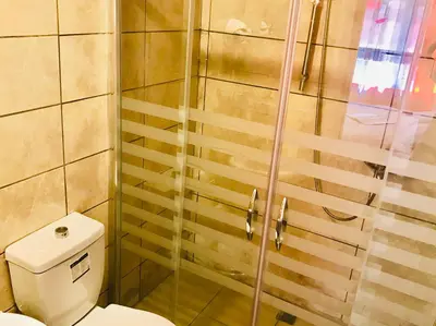 a bathroom with a shower and a toilet at Istanbul Harmony Hostel in Istanbul