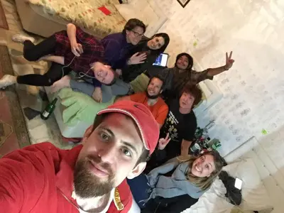 a group of people posing for a picture in a room at Istanbul Harmony Hostel in Istanbul
