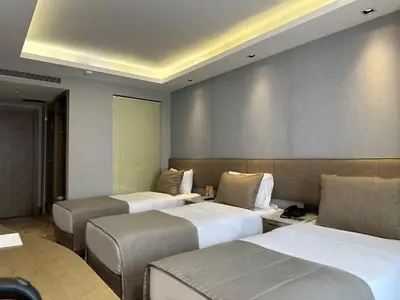 a row of beds in a hotel room at AHC Grand Bazaar Hotel in Istanbul