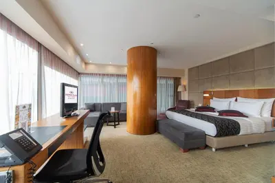 a hotel room with a bed and a desk at Crowne Plaza Istanbul Harbiye by IHG in Istanbul