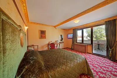 a hotel room with a bed and a table at Antea Palace Hotel & Spa in Istanbul