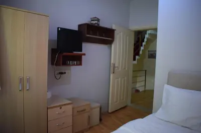 a bedroom with a bed and a tv on the wall at Sur Istanbul Hotel in Istanbul