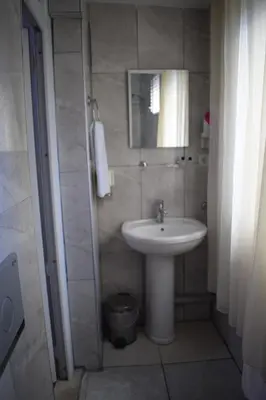 a bathroom with a sink and a mirror at Sur Istanbul Hotel in Istanbul