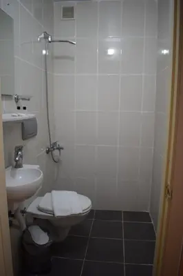 a bathroom with a shower and a toilet and a sink at Sur Istanbul Hotel in Istanbul