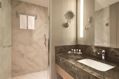 a bathroom with a sink and a shower at TRYP by Wyndham Istanbul Basın Ekspres in Istanbul