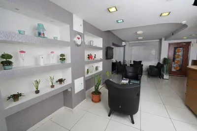 an office with a waiting room with chairs and plants at Entes Apart in Istanbul