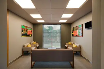 an office with a waiting room with a table and chairs at Park Inn by Radisson Istanbul Atasehir in Istanbul