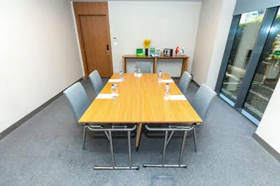 a conference room with a wooden table and chairs at Park Inn by Radisson Istanbul Atasehir in Istanbul