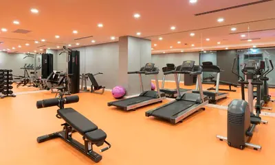 a gym with a lot of treadmills and machines at Park Inn by Radisson Istanbul Atasehir in Istanbul