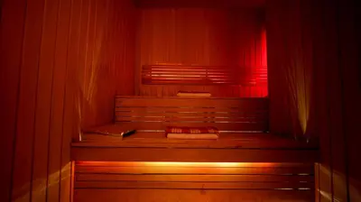 a red room with two benches and a red curtain at Mari Suites Hotel in Istanbul