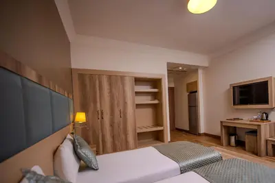 a hotel room with a bed and a television at Mari Suites Hotel in Istanbul