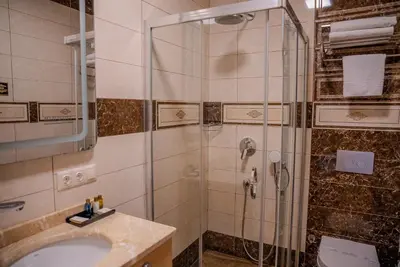 a bathroom with a shower and a sink at Mari Suites Hotel in Istanbul